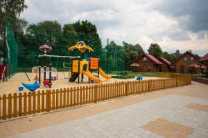 a park with a playground with a slide at Ośrodek Wypoczynkowy "u Krzysia" in Ustroń