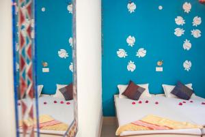 מיטה או מיטות בחדר ב-Hotel Rising Star