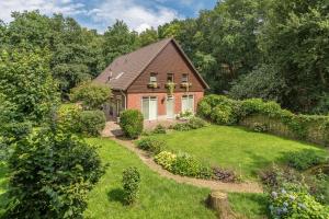 an aerial view of a house with a garden at Bed & Breakfast aan de Beek in Arcen