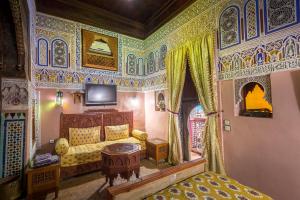 Postel nebo postele na pokoji v ubytování Riad Hiba + 37 fotografií