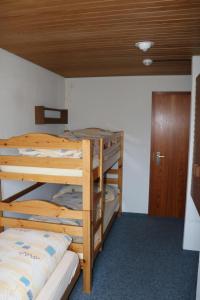 Postel nebo postele na pokoji v ubytování juhui Lenzerheide