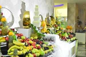a display of fruits and vegetables on a buffet at Azura Deluxe Resort & Spa - Ultra All Inclusive in Avsallar