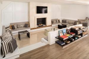 a living room filled with furniture and a fireplace at Melia Marbella Banús in Marbella