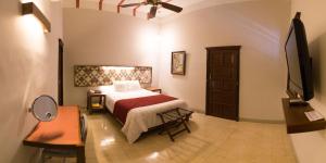 Postel nebo postele na pokoji v ubytování Hotel Caribe Merida Yucatan