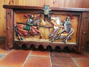 a wooden box with a painting of a man on a horse at Casa Elia in Venice