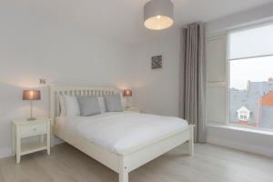 Postel nebo postele na pokoji v ubytování Citystay Living - Vesta Apartments