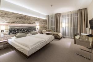 Ein Bett oder Betten in einem Zimmer der Unterkunft Arkadenhaus - Hotel Freiherr von Schwarzenberg