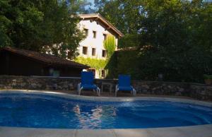 The swimming pool at or close to Hotel Can Blanc