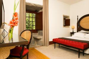 Cama ou camas em um quarto em Pousada Mosteiro de Guimaraes