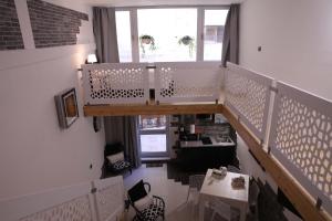 a room with a staircase and a table and chairs at BENinCASA in Lecce