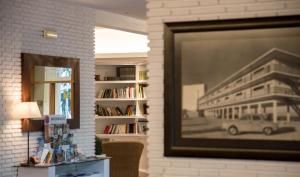 a living room with a picture of a building at Carlos III in Sant Carles de la Ràpita