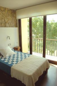 Tempat tidur dalam kamar di El Lacayo de Sestiello