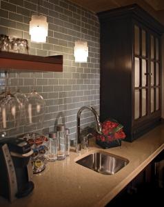 a kitchen with a sink and a counter top with a sink at The Inn At Fox Hollow Hotel in Woodbury