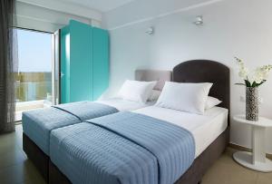 Postel nebo postele na pokoji v ubytování Coral Hotel