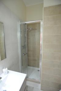 a bathroom with a shower and a white sink at Arianna in Salerno
