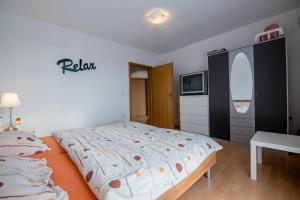 Posteľ alebo postele v izbe v ubytovaní Ferienhaus Bucic