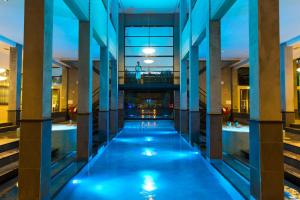 a view of a pool in a building at night at Hotel & Wellness Zuiver in Amsterdam