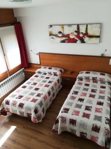 Postel nebo postele na pokoji v ubytování La Muralla