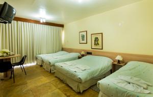 Postel nebo postele na pokoji v ubytování Marina´s Palace Hotel