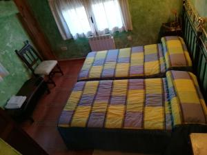 Postel nebo postele na pokoji v ubytování Casa Rural La Muralla