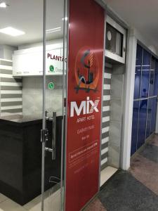 a door in a building with a sign on it at MIX APART Hotel in Brasília
