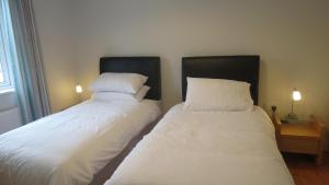 Letto o letti in una camera di Modern Home in the Heart of Rosscarbery Village