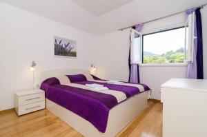 Postel nebo postele na pokoji v ubytování Apartments Stermasi