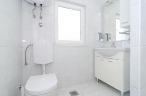 Koupelna v ubytování Apartments Stermasi
