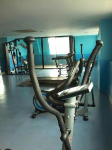 a gym with several exercise bikes in a room at Nice view over the heart of Bangkok in Bangkok