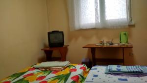Postel nebo postele na pokoji v ubytování Hotel Uyut