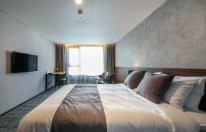 TV a/nebo společenská místnost v ubytování Hotel With Jeju