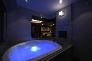 TV a/nebo společenská místnost v ubytování Hotel Aria(Adult Only)