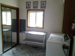 a small room with a table and a window at A Relaxing Getaway SolDuc 1 in Forks