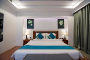 Voodi või voodid majutusasutuse The Tito Suite Residence toas
