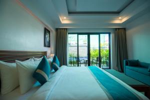 Voodi või voodid majutusasutuse The Tito Suite Residence toas
