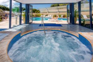 a hot tub in the middle of a swimming pool at BIG4 Middleton Beach Holiday Park in Albany