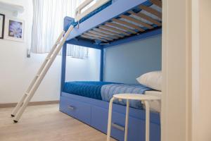 A bed or beds in a room at Casa Prima Fila Mare