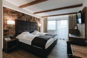 DER GREIL - Wein & Gourmethotel客房内的一张或多张床位