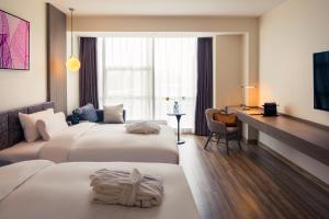 Postel nebo postele na pokoji v ubytování Mercure Shanghai Hongqiao South + 37 fotografií