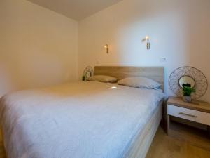 Postel nebo postele na pokoji v ubytování Apartments Livaja