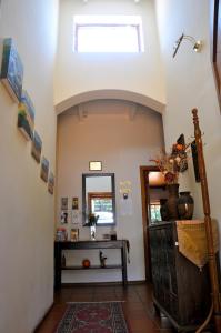 a hallway with a vaulted ceiling with a skylight at House on York in Johannesburg