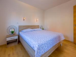 Postel nebo postele na pokoji v ubytování Apartments Livaja
