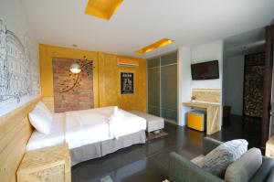 
A bed or beds in a room at SHA The Regent Resort Phuket Kamala Beach
