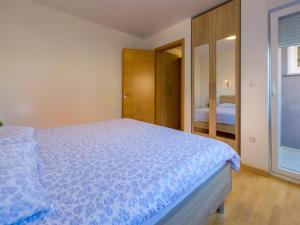 Postel nebo postele na pokoji v ubytování Apartments Livaja
