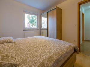 Postel nebo postele na pokoji v ubytování Apartments Livaja