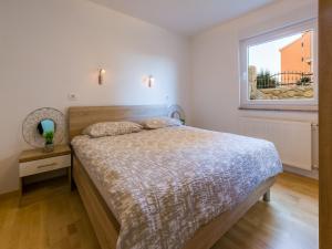 Postel nebo postele na pokoji v ubytování Apartments Livaja