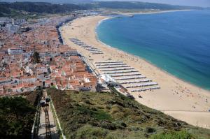 an aerial view of a beach and the ocean at Rosa House in Nazaré