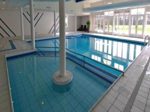 a large swimming pool in a large building at the Lighthouse in Hollum