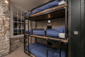 A bunk bed or bunk beds in a room at The Baxter Hostel