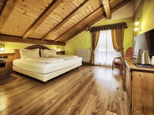 Voodi või voodid majutusasutuse Hotel Bertelli toas